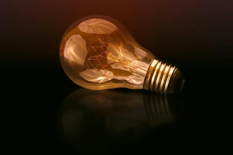 selective focus photography of light bulb