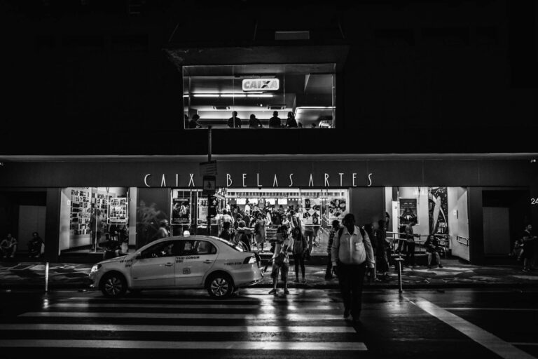 car parked on the street in grayscale